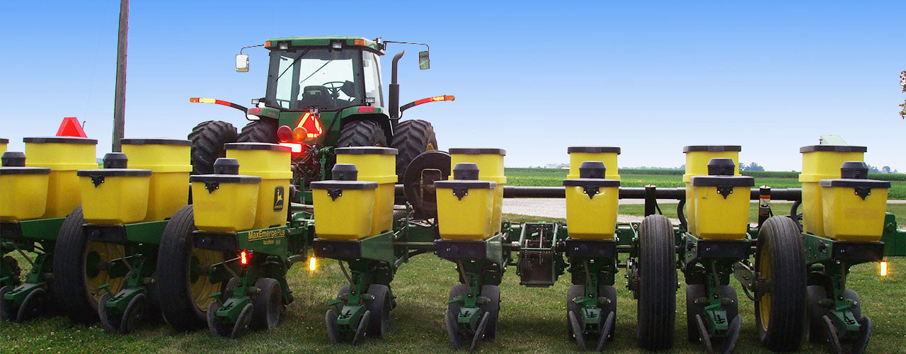 Planting implement pulled by a tractor